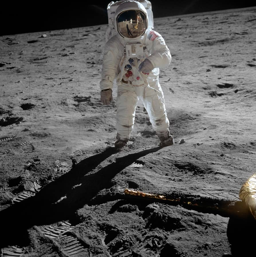 Astronaut Buzz Aldrin standing on the Moon in his spacesuit
