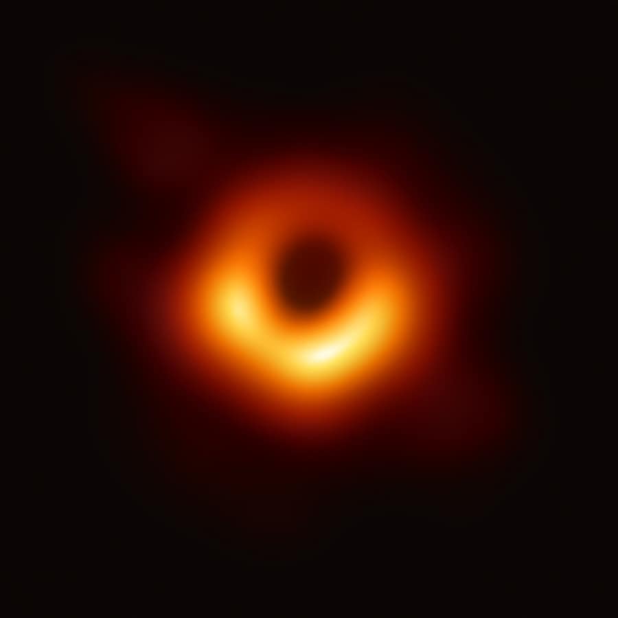 The Event Horizon Telescope image of M87*, a bright orange ring around a dark centre